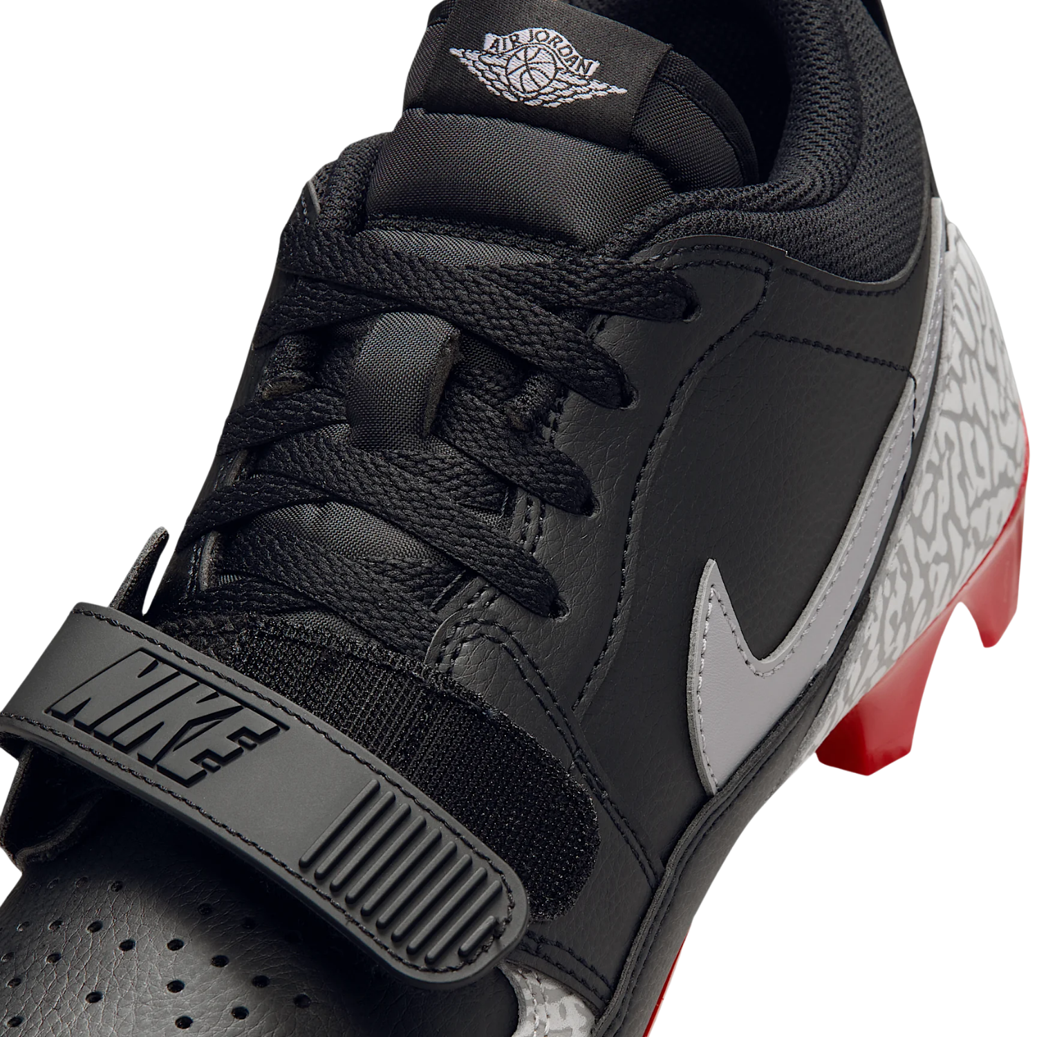 Jordan Legacy 312 Low TD closeup of the black leather upper with white Jumpman swoosh and Nike strap