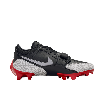 Jordan Legacy 312 Low TD cleat in black and cement grey, lateral view with midfoot strap